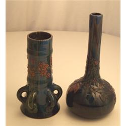 Eltonware vase having elongated neck decorated with raised flowers on a mottled blue ground, base...