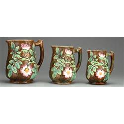 Set of three 19th Century English majolica graduated jugs decorated with raised Dog Rose and leaf...