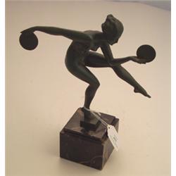 Art Deco style green finish spelter figure of a nude girl dancing with discs, signed Derenne, on...