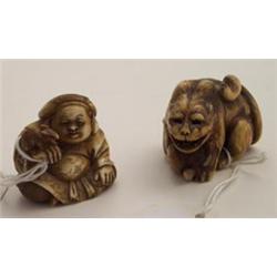 Japanese carved netsuke depicting a tiger with cub signed, 1.5  wide Est.: £200 -250...