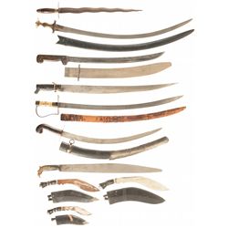 Grouping of Edged Weapons Including Swords Machetes and Kukris