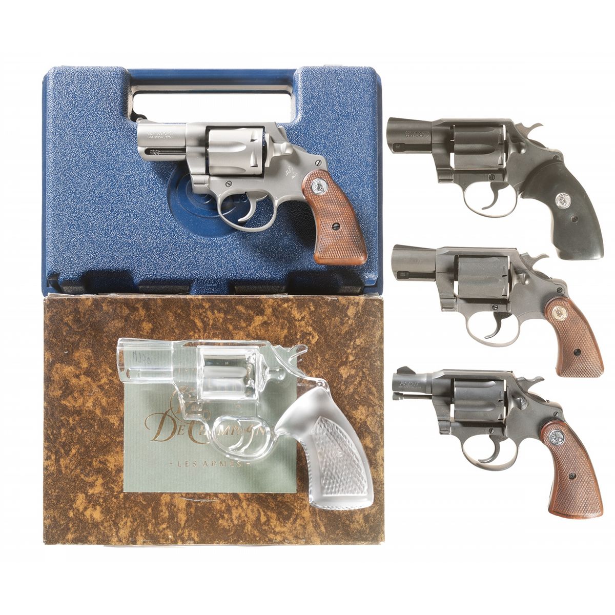 Four Colt Double Action Revolvers and a Crystal Pistol