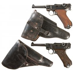 Collector's Lot of Two Luger Pistols with Holsters