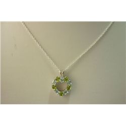 17.35 ctw peridot and blue topaz Pendant with chain .92