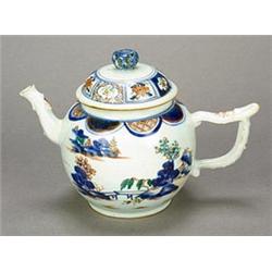 A Chinese export teapot and cover, decorated in underglaze blue and enamels with a river landscap...