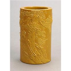 A pale brown-glazed brushpot circa 1900, well carved with two horses playing on a riverbank (wood...