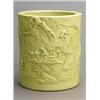 Image 1 : A pale yellow-glazed brushpot by Li Yucheng, carved with monkeys playing in a landscape, wood sta...