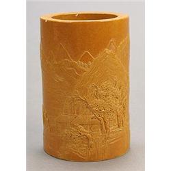 A brown-glazed brushpot, carved in low relief with mountainscapes, 13.5cm, mark of Zhang Maiyi (m...