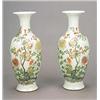 Image 1 : A pair of 'famille-rose' vases each of tapering ovoid form with trumpet neck, painted with chrysa...