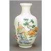 Image 1 : An egg-shell 'famille-rose' vase, delicately enamelled on one side with Shou Lao and two boys car...
