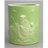 Image 1 : A pale-green glazed brushpot carved in high relief with a Shou Lao and a boy beside a deer and fi...
