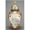 Image 1 : A large oriental export ovoid vase and cover enamelled in colours with panels of flowers on an ir...
