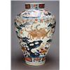 Image 1 : A large Japanese Imari ovoid vase, decorated in underglaze blue, iron red and gilt with a crane a...