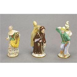 Three Meissen figural scent flasks and stoppers, comprising; a model of a friar carry a goose, on...