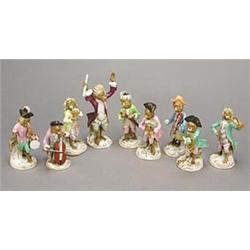 A Volkstedt monkey band of nine figures, typically modelled wearing eighteenth dress and playing...