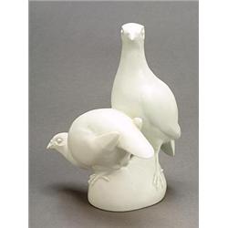 A Meissen white porcelain ornithological group of two partridges, modelled by Weiss, 18cm high, b...