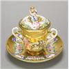 A Continental porcelain Naples style two-handled cabinet cup, cover and stand, moulded con basso...