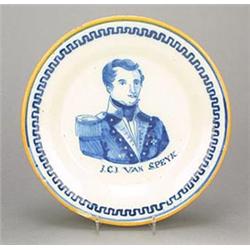 A Delft portrait plate, painted in blue with a bust portrait of a naval lieutenant titled J.C.J....