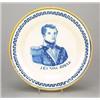 A Delft portrait plate, painted in blue with a bust portrait of a naval lieutenant titled J.C.J....