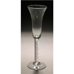 An airtwist ale flute, the flared bowl supported on a stem filled with spiral threads, on a conic...