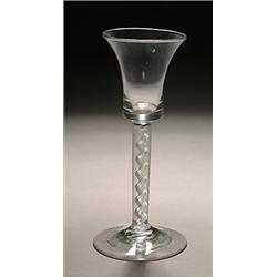 An airtwist wine glass, the waisted bucket bowl supported on a stem enclosing a spiral gauze core...