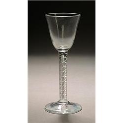 An airtwist wine glass, the round funnel bowl supported on a double series stem and conical foot,...