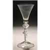 An airtwist wine glass, the funnel bowl with solid lower section and cushion knop, on a double-kn...