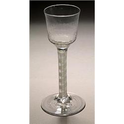 An opaque-twist wine glass, the ogee bowl with hammered lower section, on a double series stem an...