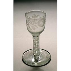 An engraved opaque-twist firing glass, the ogee bowl with a bird in flight and a flowerhead, supp...