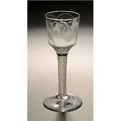 An engraved opaque-twist wine or ale glass, the ogee bowl with a hop sprig and ears of barley, su...