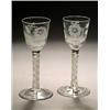 Image 1 : A pair of engraved opaque-twist wine glasses of Jacobite significance, the ogee bowls with a rose...