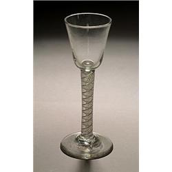 An opaque-twist wine glass or cordial, the round funnel bowl supported on multi-ply corkscrew ste...