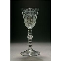 A Dutch-engraved light-baluster goblet, the round funnel bowl engraved with arms of four lions ra...