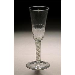 An opaque-twist ale flute, the funnel bowl with hammered lower section section, on a double serie...