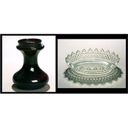 An amethyst hyacinth vase, with waisted neck and compressed lower section, 15cm high, first half...