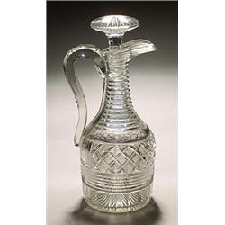A cut claret jug and stopper, of club-shaped form, the tapered cylindrical neck cut with horizont...