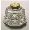 A cut brass-mounted octagonal inkwell and hinged cover, cut all over with broad diamond facets, t...