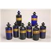 Eight similar blue chemists' bottles and stoppers, of shouldered cylindrical form, one applied wi...