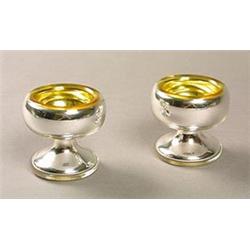 A pair of Varnish & Co. silvered pedestal salts, with gilt interiors, 7.5cm high, inset patent di...