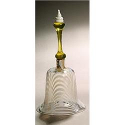 A model of a hand bell, the amber handle with opaque-white finial, the clear bell with opaque-whi...