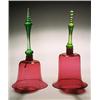 Image 1 : Two similar cranberry models of hand bells, each with a uranium-green handle, 27.5cm & 29cm high,...