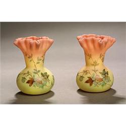 A pair of 'Burmese Ware' purse vases with shaped and crimped rims, painted with floral sprays, 10...