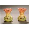 A pair of 'Burmese Ware' purse vases with shaped and crimped rims, painted with floral sprays, 10...