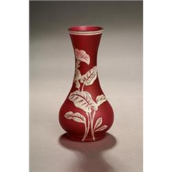 A Stourbridge cameo bottle vase, white overlaid on pink, carved with convolvulus flowers and foli...