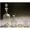 A Stourbridge engraved decanter and globular stopper, oviform on a domed foot and with slender ne...