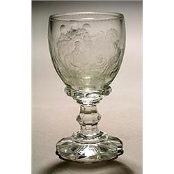 A Bohemian clear and intaglio engraved goblet, engraved and polished with a domestic scene of par...
