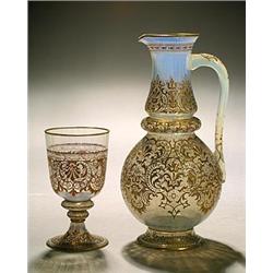 A J. & L. Lobmeyr opalescent engraved ewer and goblet, each engraved and gilt with a scrolling fo...