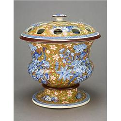 A pot-pourri vase with covers attributed to Spode, printed in blue with a large sprays of flowers...