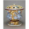 A pot-pourri vase with covers attributed to Spode, printed in blue with a large sprays of flowers...