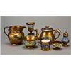 Image 1 : A miscellaneous selection of mostly copper-lustre pottery, comprising; a pepper-pot, two salts, t...